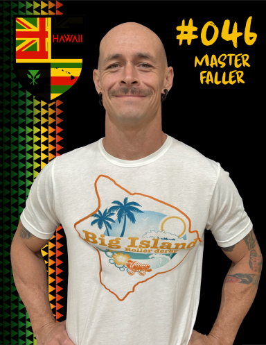 Man with a mustache wearing a white t-shirt featuring a tropical design and a "#046" label.